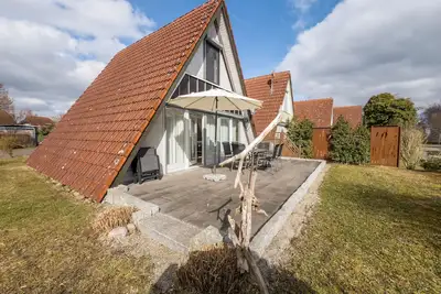 Image de Maison de vacances 'Wikinger 74' avec terrasse privée, jardin privé et Wi-Fi