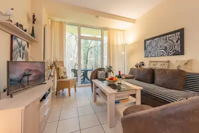 Image de SĂĽdwind 21 - Holidays in Zempin for four people with balcony, elevator, sauna and ski room.