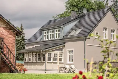 Image de Landhaus hinter'm See vacation apartment Landliebe luxurious winter garden tiled stoves