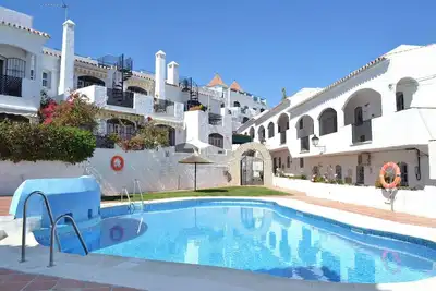 Image de Sunny 2 bed apartment in a complex with pools close to village centre and beach.