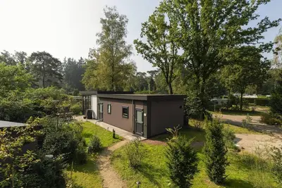 Image de The Heide Lodge offers a luxurious and comfortable holiday experience on a spacious plot with a private garden and excellent amenities.