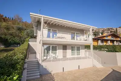 White Apartment with Terrace and Lake View
