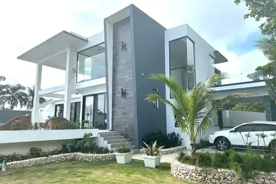 Image de Modern Oceanfront  4-bedroom house with pool, WiFi, Ac in lovely town of Cabrera
