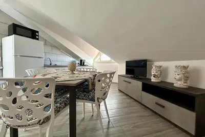Image de Attic room is unique and cozy in the center of the village.