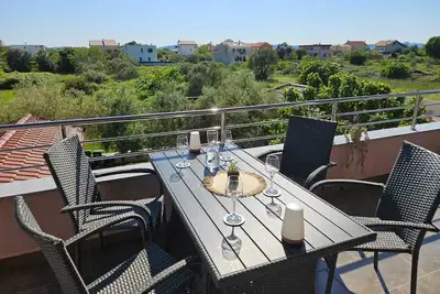 Image de 500 m to the beach with a unique view and large terrace