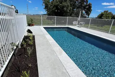 Image de Coastal Bliss: 3-Bedroom Beachside Escape with Pool, Just 3 Minutes to the Sand!