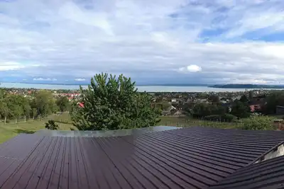 Image de A newly renovated old wine cellar with a view of Lake Balaton and the city.