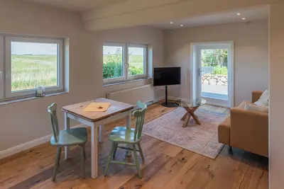 Image de The Möwennest in a quiet location just before the dike, with terrace and beach chair.