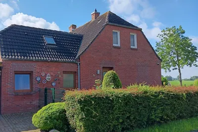 Image de Maison de vacances Krummhörn pour 1 - 6 personnes avec 3 chambres à coucher - Maison jumelée
