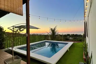 house with a beautiful sea view in enchanting SurfCity with WiFi, Ac and Pool.