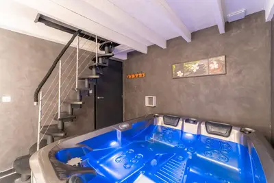 Image de Appartement avec Jacuzzi et Sauna