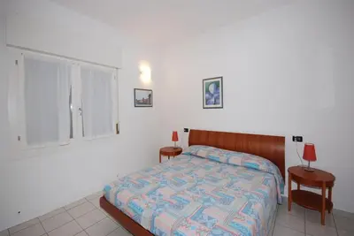 Image de Appartement entièrement rénové avec terrasse dans un quartier calme de Lignano Pineta