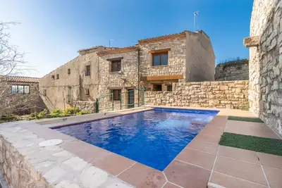 Image de Maison de campagne 'Cal Xavier De Segura' avec piscine privée, jardin privé et Wi-Fi