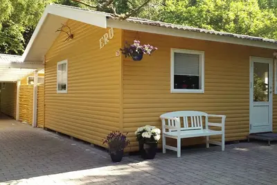 Image de Cosy cottage in forest just 100 m from the beach