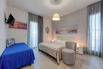 Image de Chambre 'Donna Riccia' avec Terrasse partagée, Wi-Fi et Climatisation