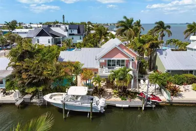Image de Beautiful waterfront home with pool and boat dock - steps to the beach!