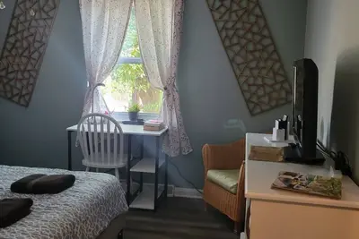 Image de A beautiful and cozy yellow house. The house is divided into 2 separate apartments.