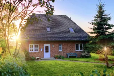 Image de Maison de vacances 'Ferienhaus Immerlicht Norddeich S-H' avec terrasse privée, jardin privé et Wi-Fi