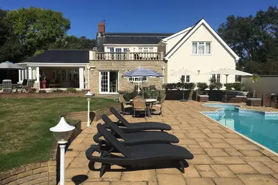 Beautiful five bedroomed family home in Guernsey with heated pool
