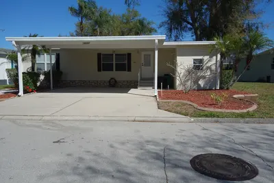Image de Charming 2-Br mobile home, WiFi, Ac, 3 community pools, 6 miles from Disney World