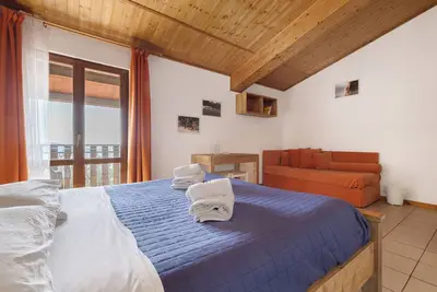 Image de Chambre 'Matrimoniale Con Balcone' avec vue sur lac, jardin partagé et Wi-Fi