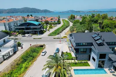 Image de New 3-bedroom apartment with sea view and common pool in Fethiye with WiFi, Ac.