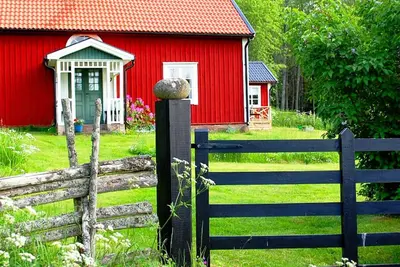 Image de Red and white holiday home near the forest and not far from the lake and swimming facilities