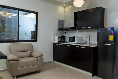 Image de First floor room with small living room and kitchenette