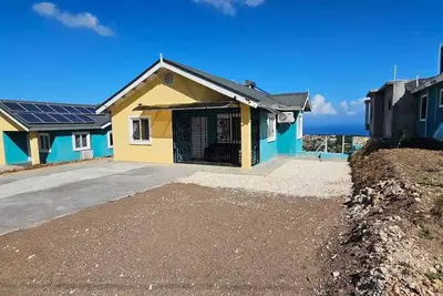 3b 2b Pure Ocean View on top of the Ridge Overlook Rose hall with Ac & King Beds