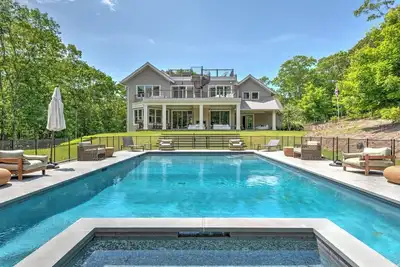 Image de Modern-style home with heated private pool, open-floor plan, ample natural. . .