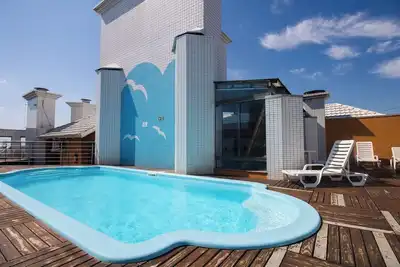 Image de Apto c churrasq, piscina e wi-fi a 200m da praia