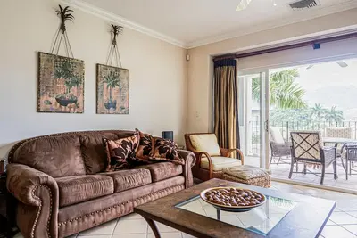 Spacious apartment with balcony views, pool access, kitchen & golf course nearby