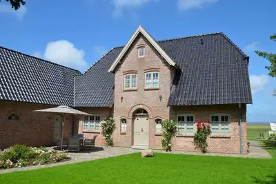 Image de Spacious property in the first row on the Wadden Sea! This luxurious detached house b