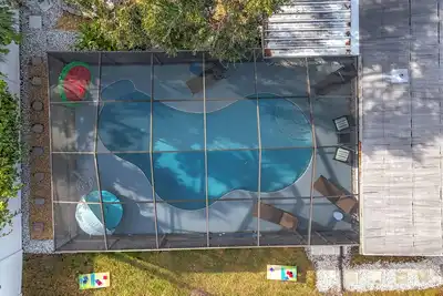 Image de New - Tropical 3br Pool Home w/ Fire Pit & Putting Green minutes to Gulf Beaches