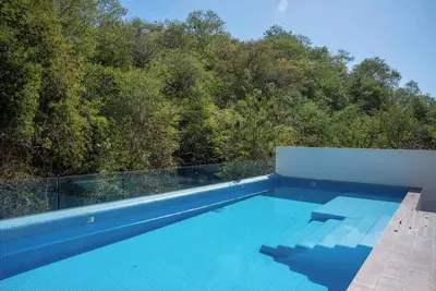 Image de Cozy 1-bedroom condo in the quiet community of Sector K with Ac, Starlink & Pool