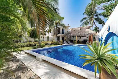 Image de Serene Escape with Pool Surrounded by Lush Gardens