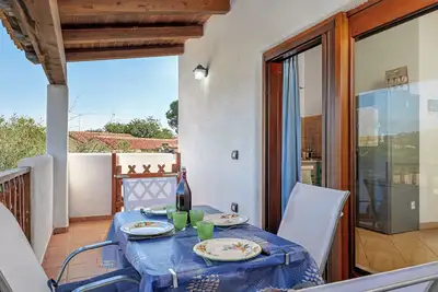 Appartement 'Con Vista Porto Taverna' avec vue sur mer, terrasse privée et climatisation