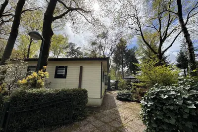 Image de Big deluxe chalet with private jacuzzi, swimming pool on park.