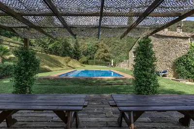 Image de Maison de vacances 'Can Soler De Merlant 2' avec vue sur la montagne, piscine partagée et Wi-Fi