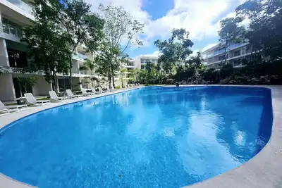 Image de Escape to a Modern Playacar Condo with Pool & Tranquil Nature Views