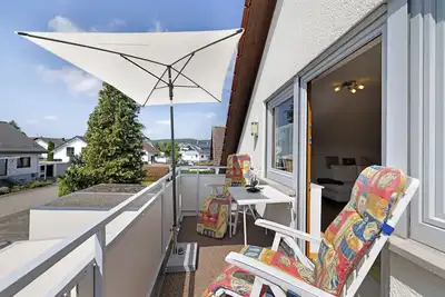 Image de Appartement 'Urlaub In Der Sonnenstadt 72351' avec balcon et Wi-Fi