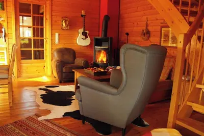 Image de Cozy vacation home with fireplace furnished in western style.