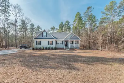 Image de Masters Rental-14 minute drive, 4-bedroom house, with privacy, screened porch