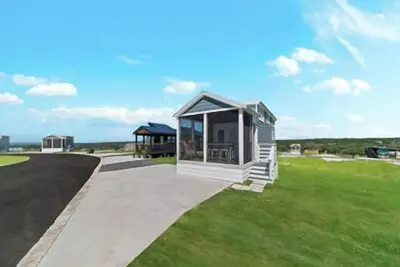 Image de Pet-Friendly 'The June' Features French Doors to Screened Porch, Bunk Beds, and Multi-Level Layout w