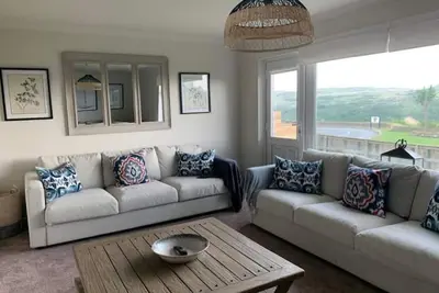Image de Coastal family home a stones throw from the beach.