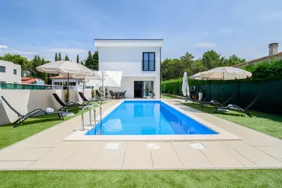 Image de Maison de vacances Poreč pour 1 - 8 personnes avec 4 chambres à coucher - Maison de vacances