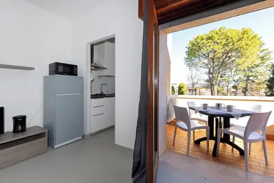 Image de Appartement 'La Pelusa Peschiera' avec piscine partagée, Wi-Fi et climatisation
