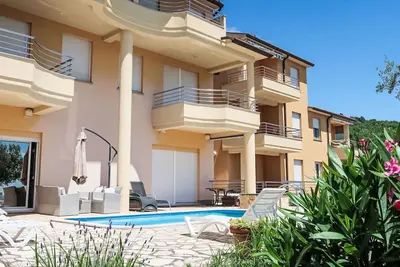 Image de Bel appartement avec climatisation, Wifi, piscine, Tv, terrasse et animaux admis