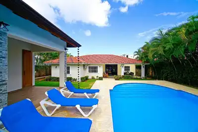 Bring your naked chicas under the waterfall pool. . .
