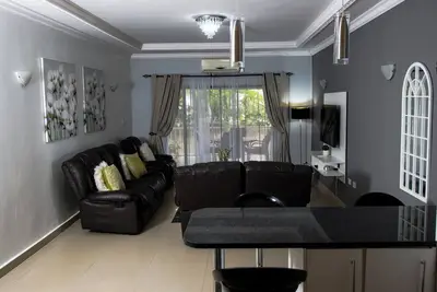 Spacious open plan 3-bedroom apartment, WiFi and power back-up in vibrant Lusaka